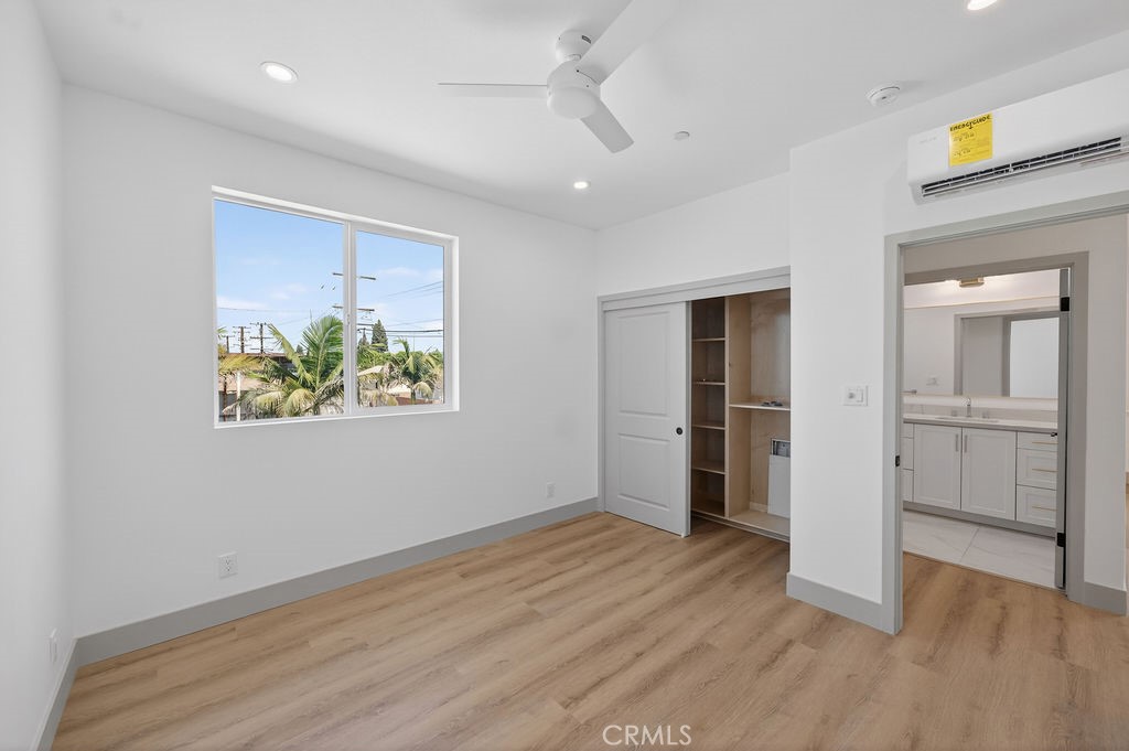 15540 Colorado Avenue Paramount, CA 90723 - Photo 63 of 63 wooden floor in an empty room with a window