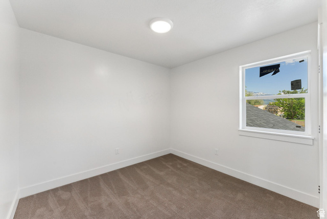 1619 North Angel Street West Layton, UT 84041 - Photo 12 of 32 Carpeted spare room with baseboards