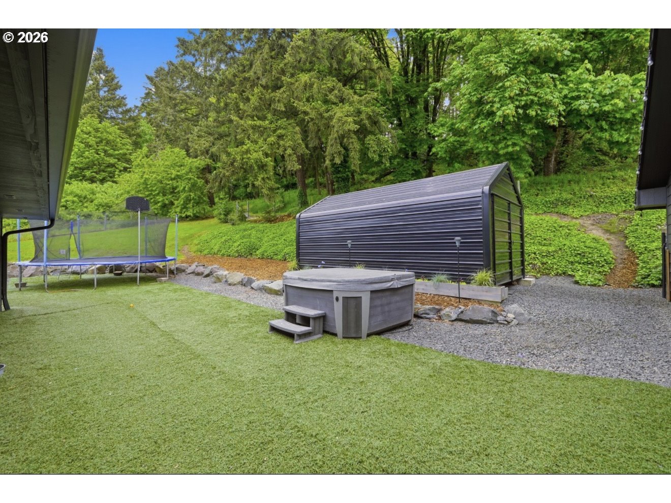 33192 Wilkins Road Eugene, OR 97408 - Photo 33 of 35 a view of a house with backyard porch and garden