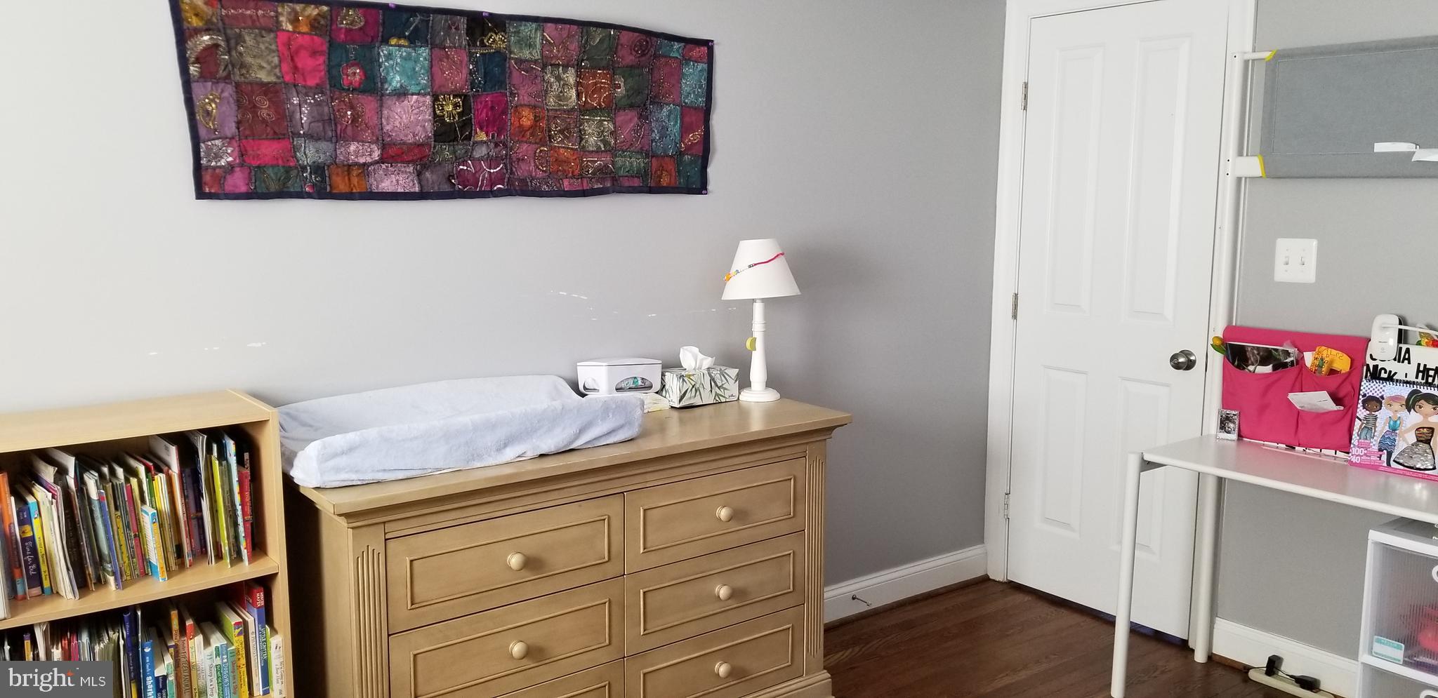 1709 Forest Glen Road Silver Spring, MD 20910 - Photo 18 of 61 a bathroom with a granite countertop sink and a painting on the wall