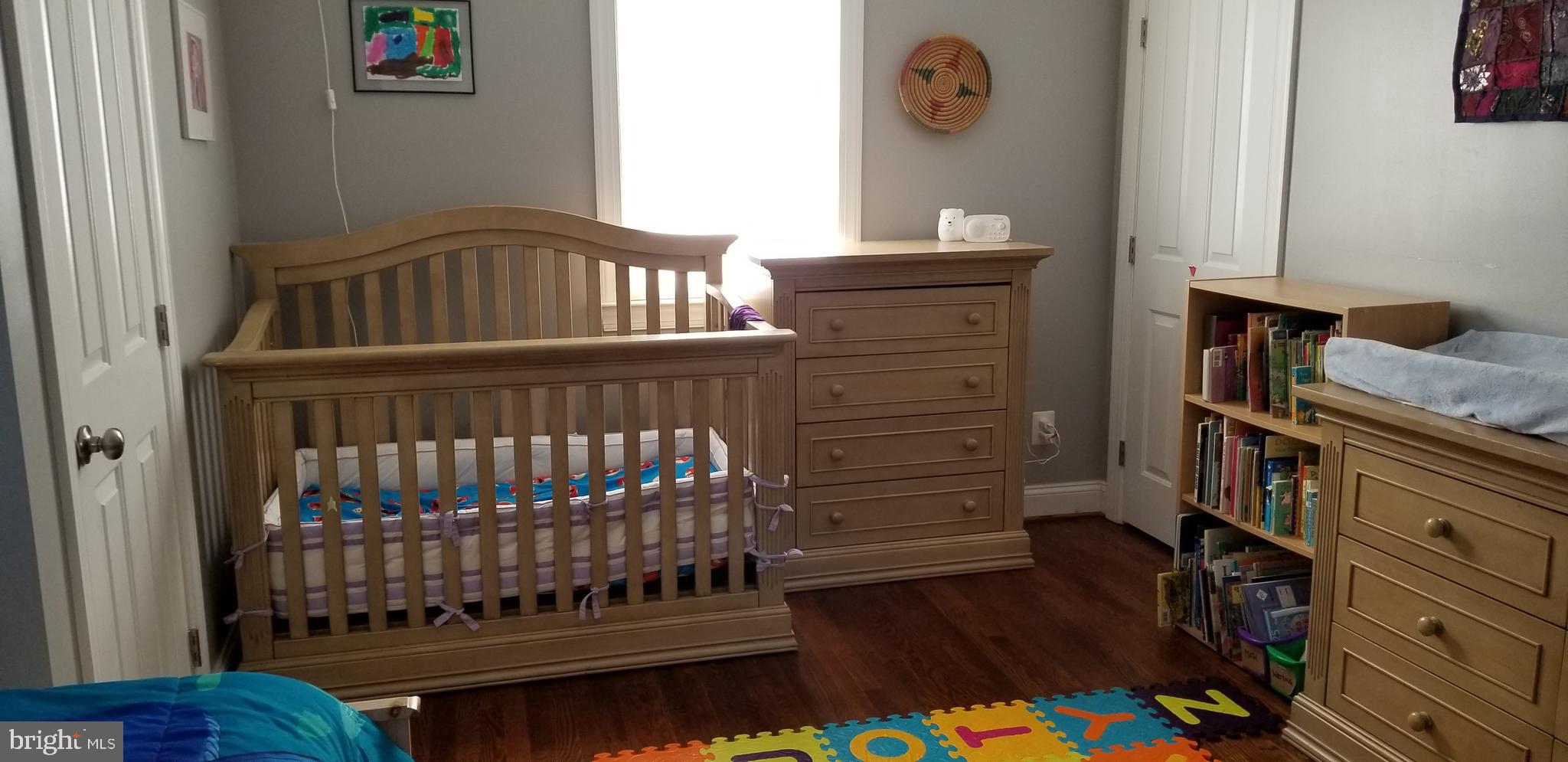 1709 Forest Glen Road Silver Spring, MD 20910 - Photo 20 of 61 a bedroom with a bed and wooden floor