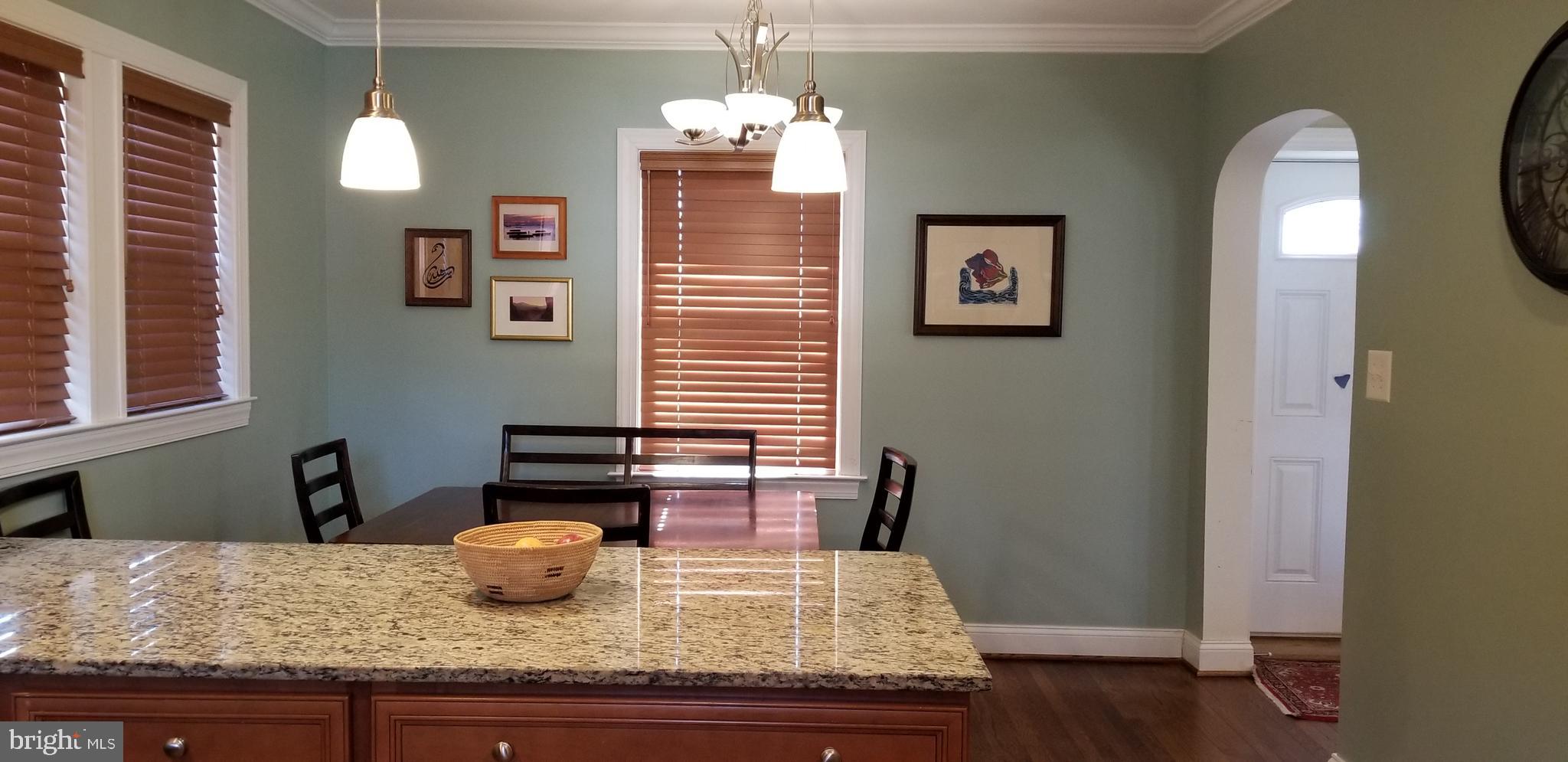 1709 Forest Glen Road Silver Spring, MD 20910 - Photo 29 of 61 a dining room with granite countertop furniture and wooden floor