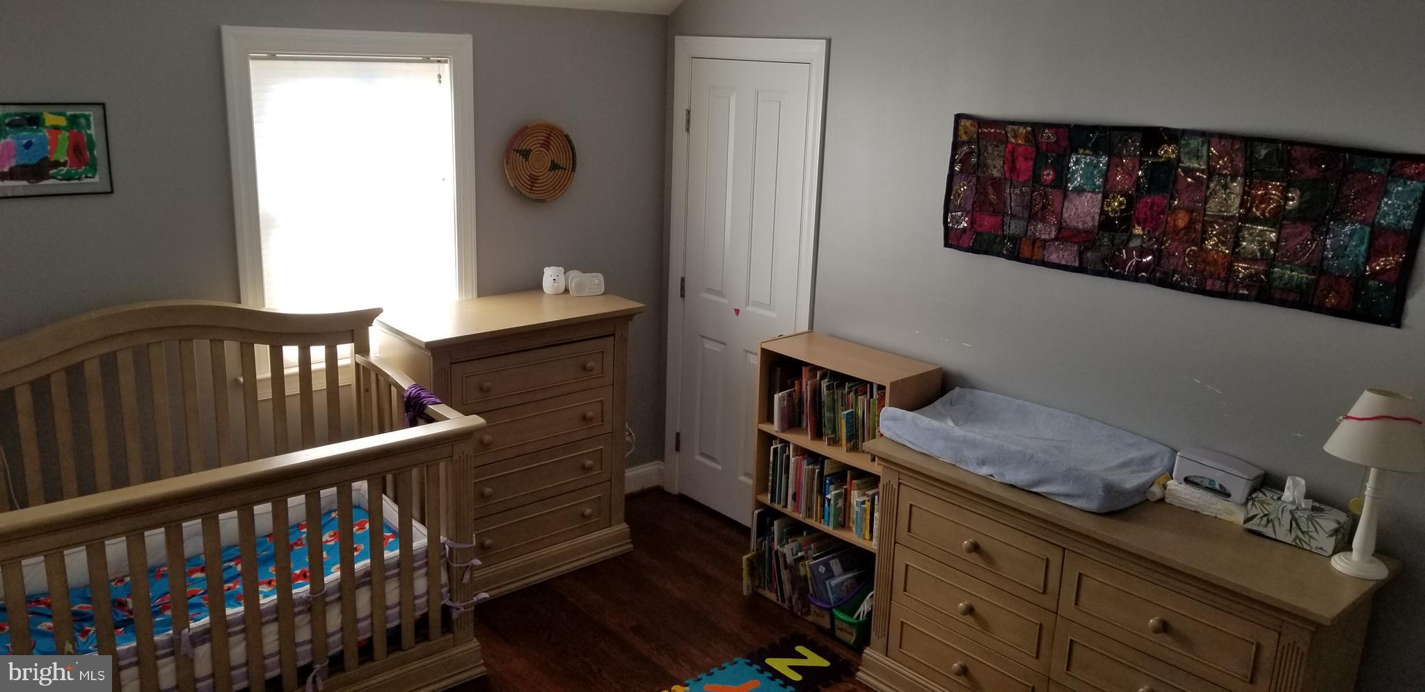 1709 Forest Glen Road Silver Spring, MD 20910 - Photo 37 of 61 a bedroom with furniture and wooden floor