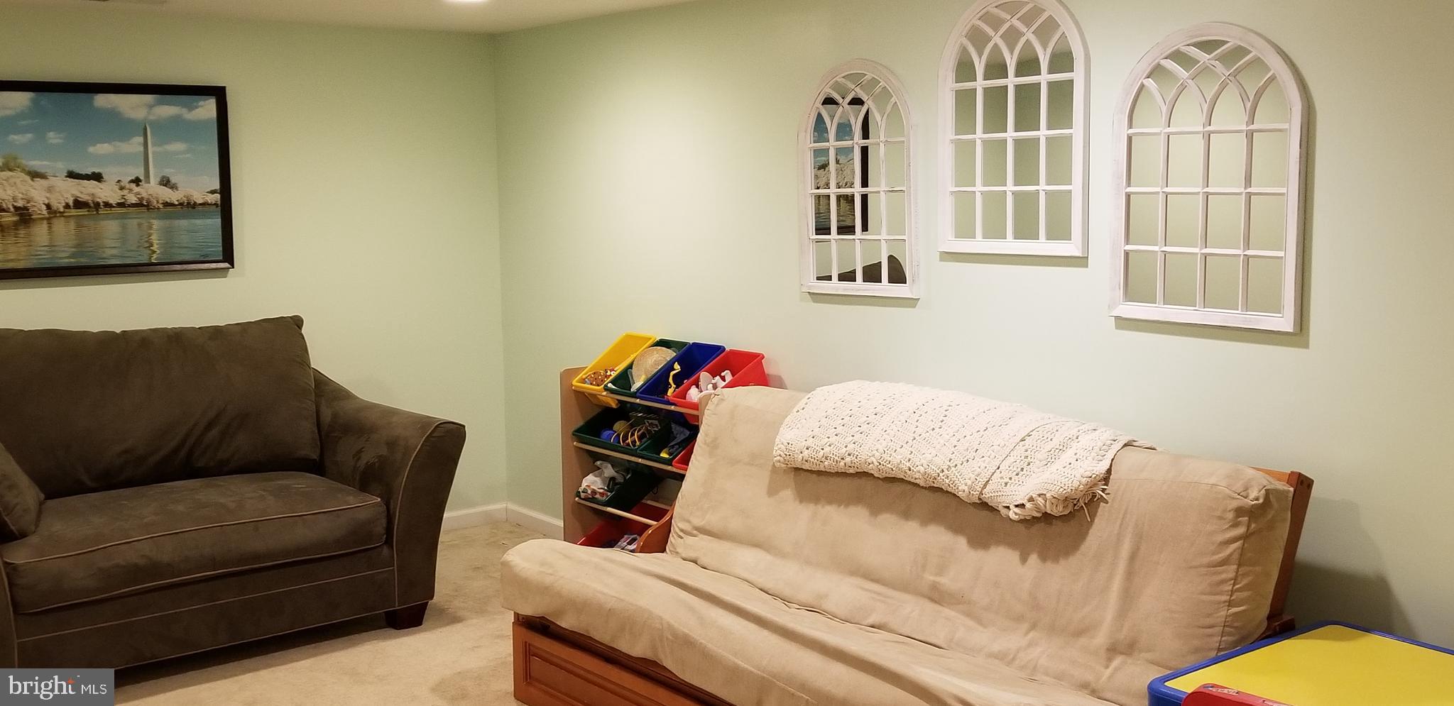 1709 Forest Glen Road Silver Spring, MD 20910 - Photo 44 of 61 a living room with furniture and a window