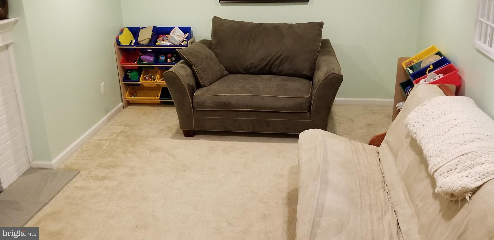 1709 Forest Glen Road Silver Spring, MD 20910 - Photo 46 of 61 a living room with furniture and a couch