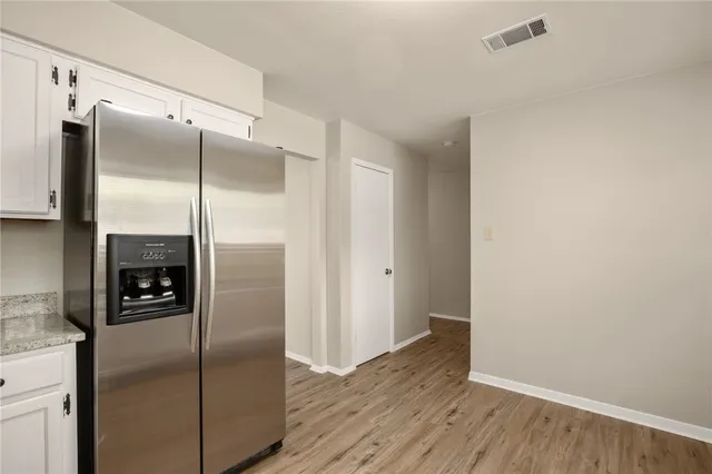 a kitchen with a refrigerator and a refrigerator