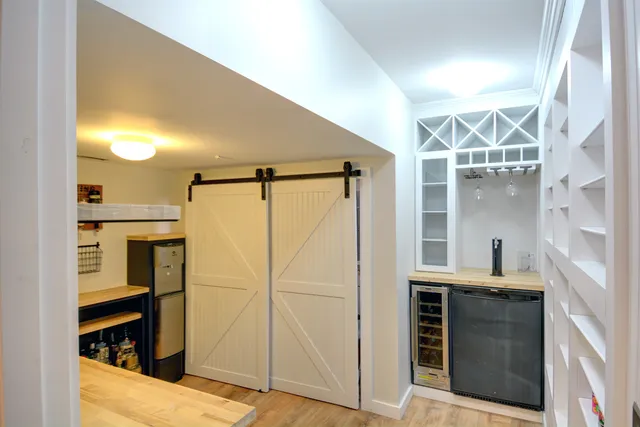 a bathroom with a shower and a sink