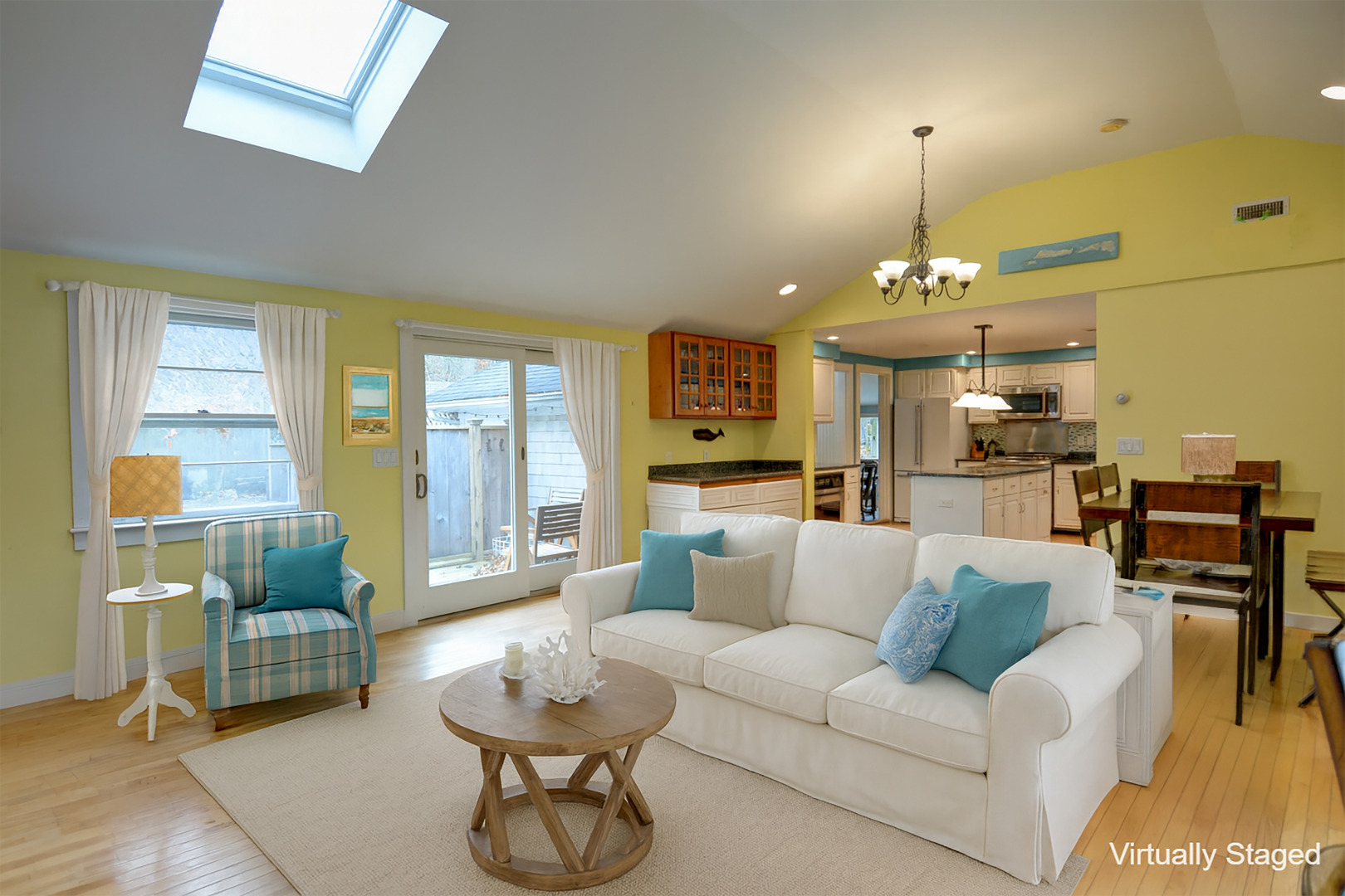 35 Mariners Way Edgartown, MA 02539 - Photo 19 of 32 a living room with furniture and a chandelier