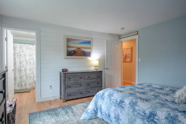 a bed room with a bed and a television