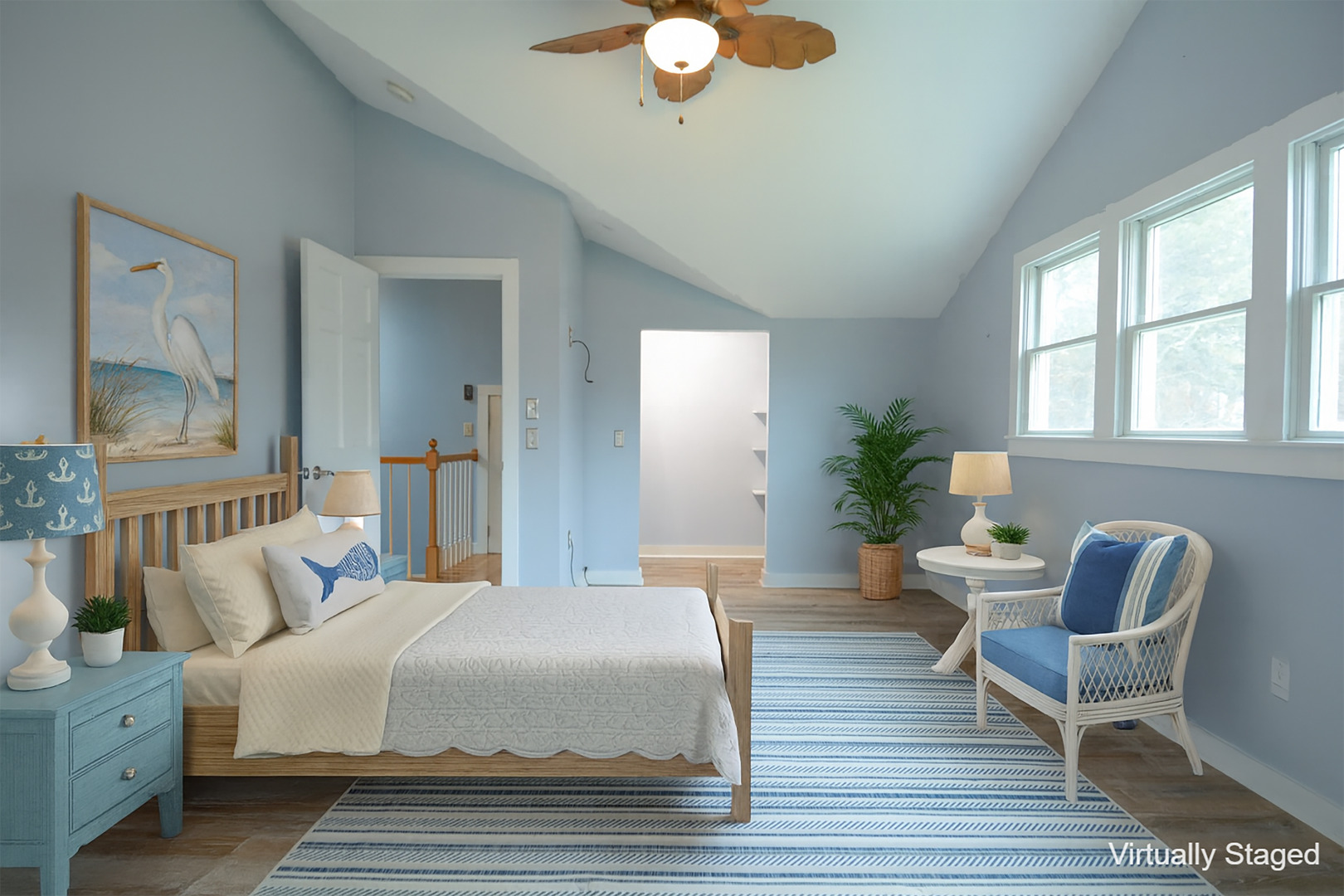 35 Mariners Way Edgartown, MA 02539 - Photo 29 of 32 a spacious bedroom with a bed a couch and potted plant on the dresser