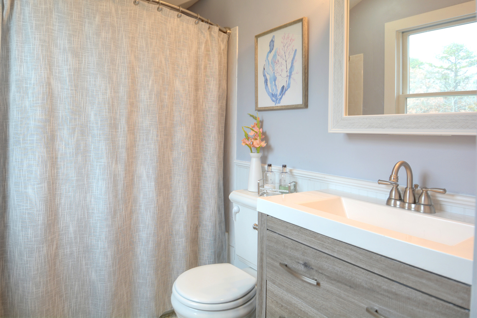 35 Mariners Way Edgartown, MA 02539 - Photo 30 of 32 a bathroom with a sink a toilet and a window