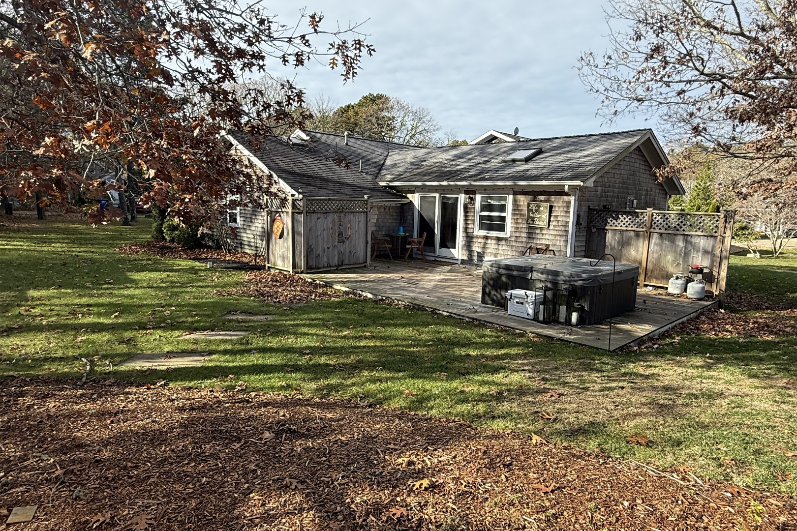 35 Mariners Way Edgartown, MA 02539 - Photo 4 of 32 a front view of a house with a garden