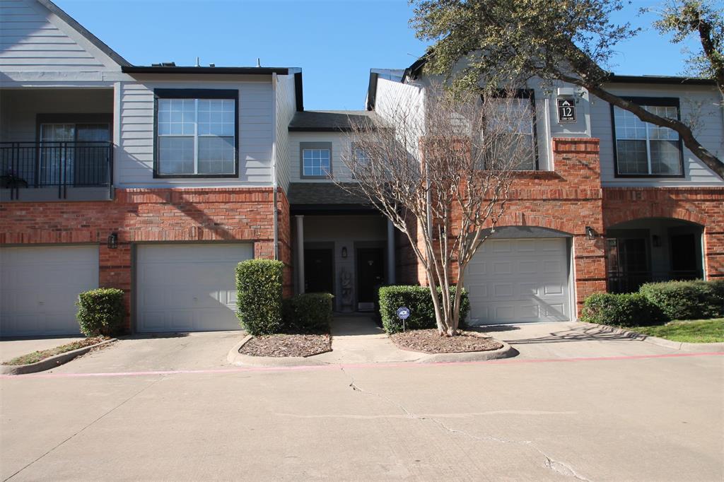 Townhome / multi-family property featuring a garage