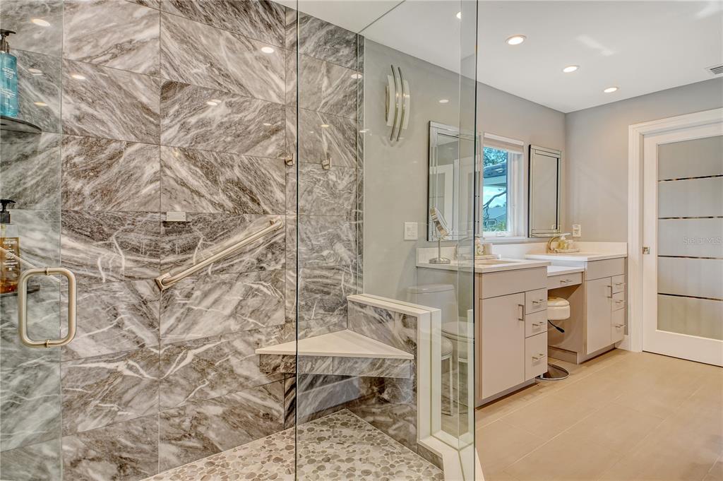 3210 Bayou Sound Longboat Key, FL 34228 - Photo 16 of 58 a bathroom with a sink and a mirror