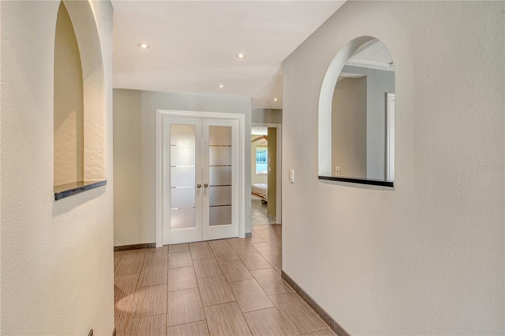 3210 Bayou Sound Longboat Key, FL 34228 - Photo 17 of 58 a view of a hallway with wooden floor and closet