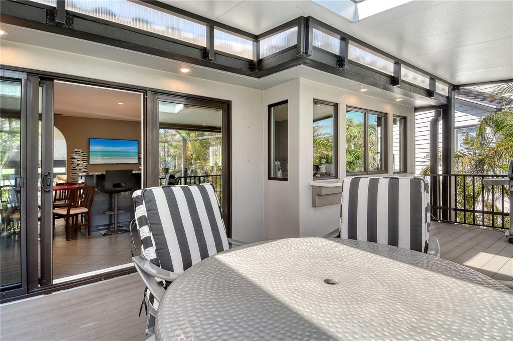 3210 Bayou Sound Longboat Key, FL 34228 - Photo 28 of 58 a view of a bedroom with furniture and floor to ceiling window