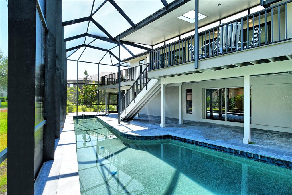 3210 Bayou Sound Longboat Key, FL 34228 - Photo 35 of 58 a view of house with staircase and wooden floor
