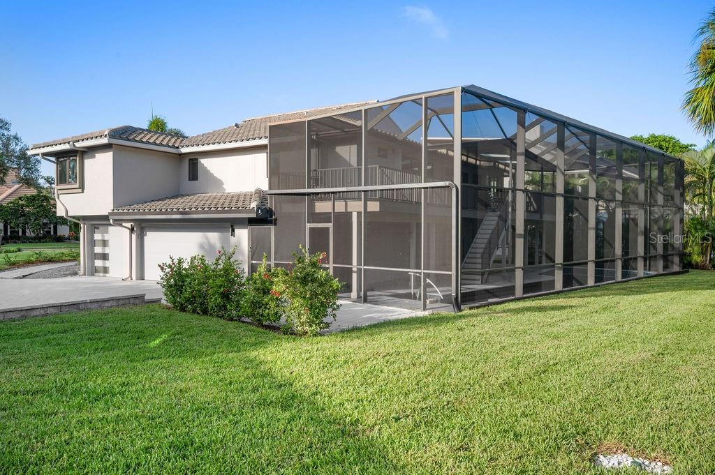 3210 Bayou Sound Longboat Key, FL 34228 - Photo 38 of 58 a front view of a house with yard