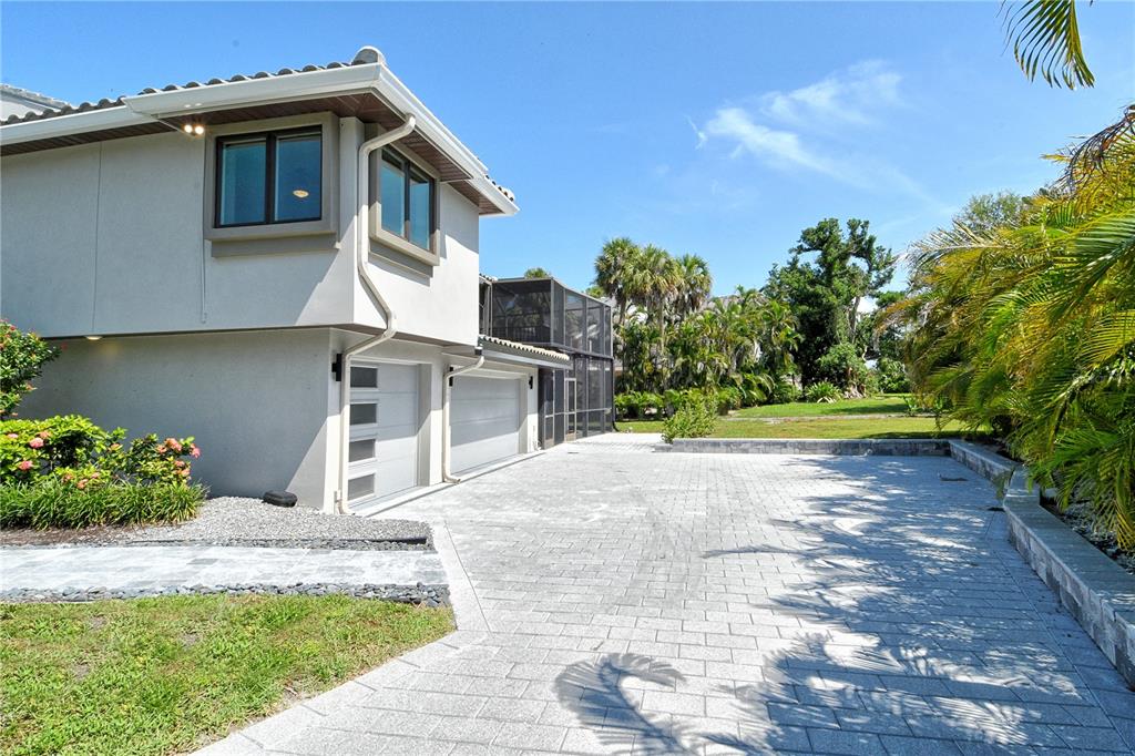 3210 Bayou Sound Longboat Key, FL 34228 - Photo 39 of 58 a front view of a house with a yard