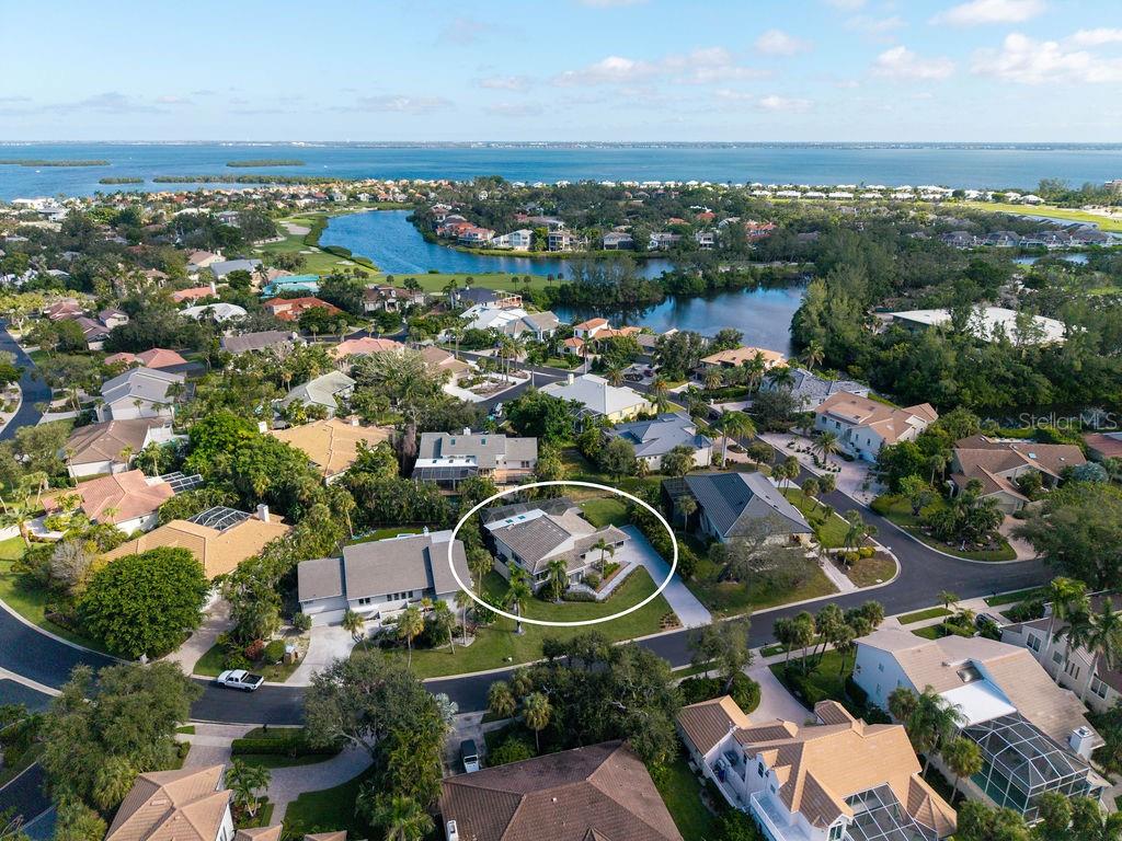 3210 Bayou Sound Longboat Key, FL 34228 - Photo 53 of 58 an aerial view of a city with lots of residential buildings ocean and mountain view in back
