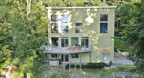 a view of kitchen with a table and chairs