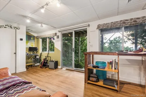 a bedroom with furniture and a window