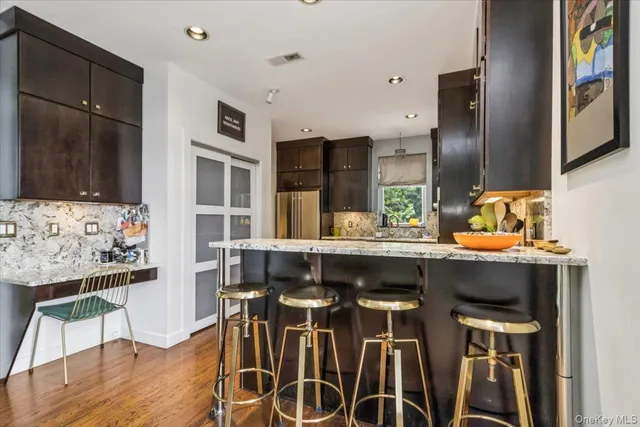 a kitchen with a sink cabinets and window
