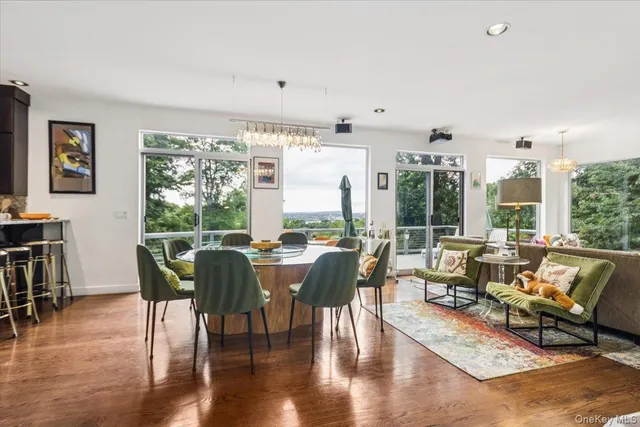 a living room with furniture and large windows