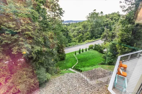 a view of a yard with a tree