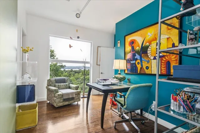 a living room with furniture a rug and a window