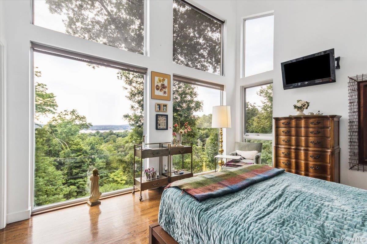 19 Melzingah Reservoir Road Beacon, NY 12508 - Photo 9 of 34 a bedroom with a bed and large window