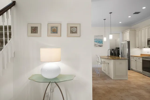 a kitchen with stainless steel appliances kitchen island a refrigerator a stove a sink and a microwave