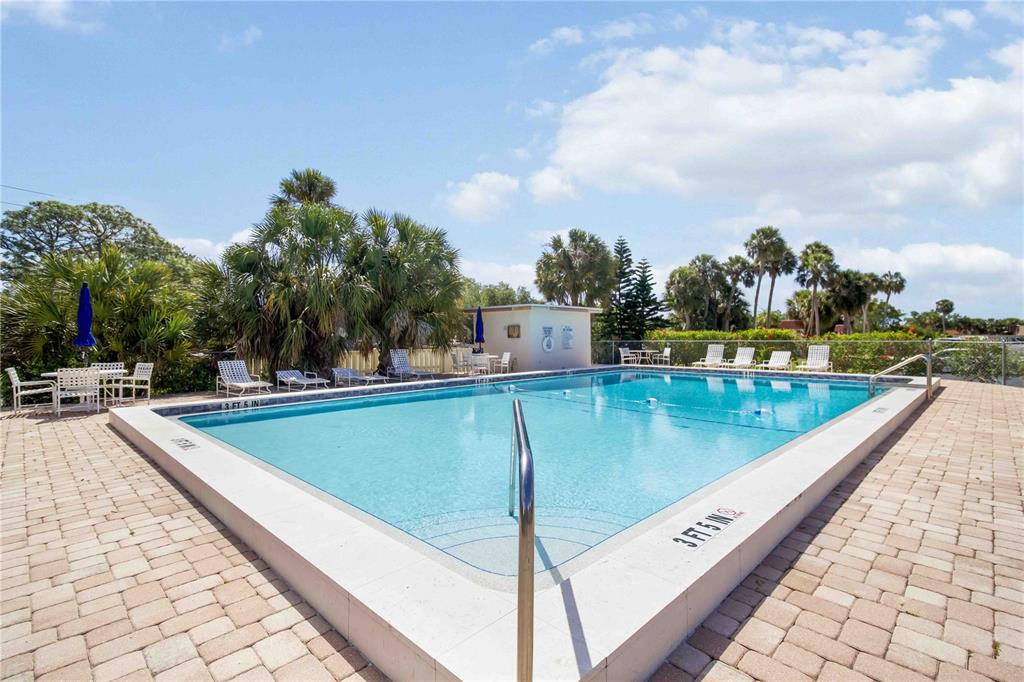 5476 Swift Road, Unit 19 Sarasota, FL 34231 - Photo 29 of 34 a view of a swimming pool with a terrace
