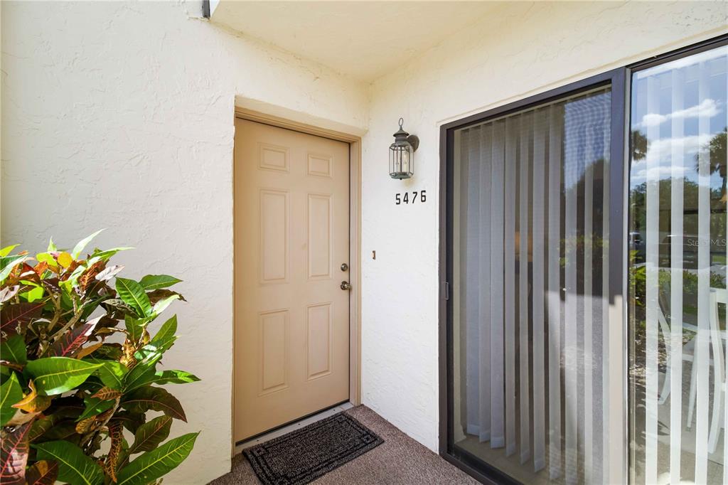 5476 Swift Road, Unit 19 Sarasota, FL 34231 - Photo 4 of 34 a view of entryway with wooden floor