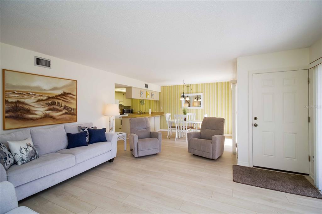 5476 Swift Road, Unit 19 Sarasota, FL 34231 - Photo 6 of 34 a living room with furniture and a large window