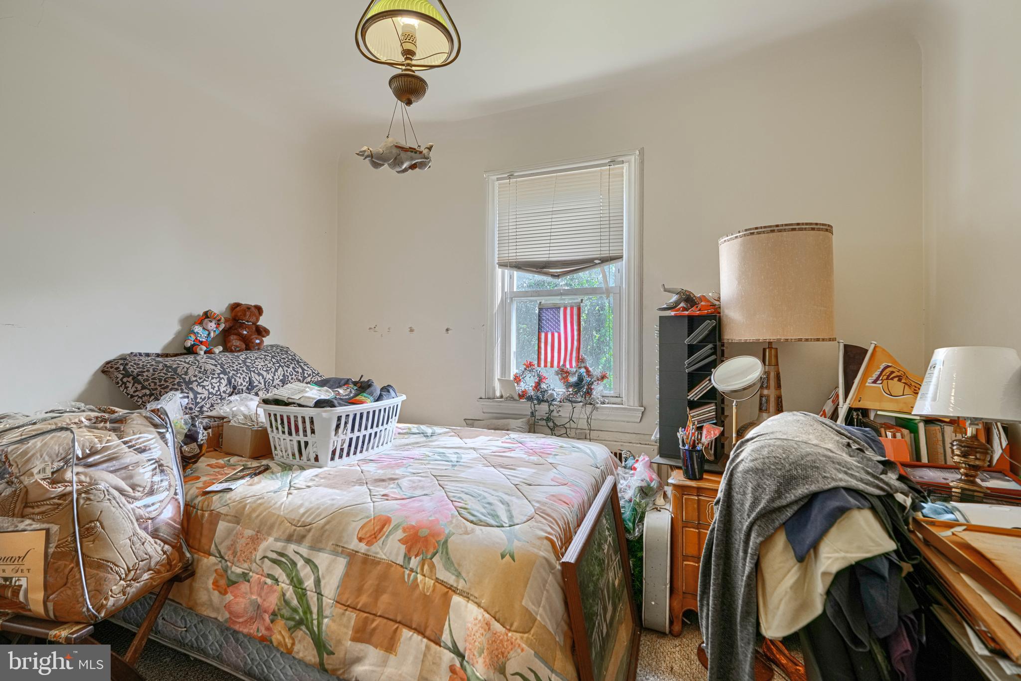 3212 Dorchester Road Baltimore, MD 21215 - Photo 30 of 45 a bedroom with two beds and a lamp