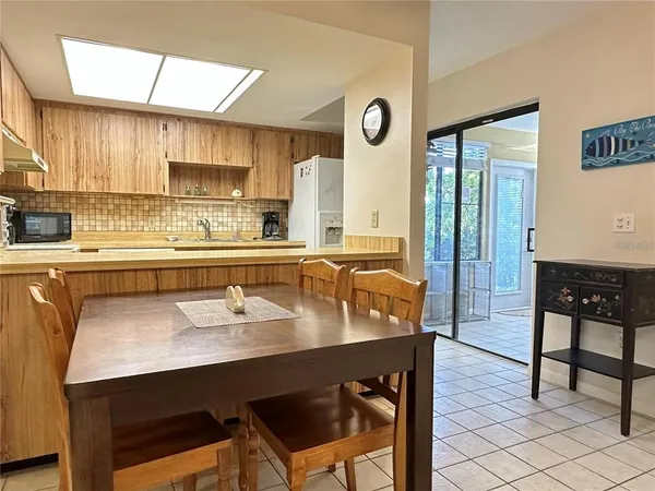 a kitchen with a sink stove and microwave