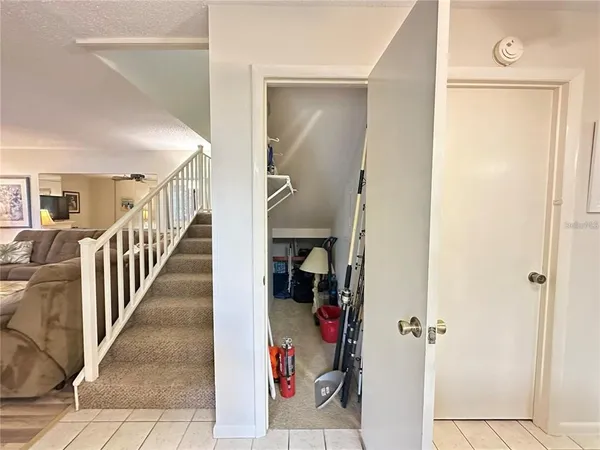 a bedroom with a bed table and dresser