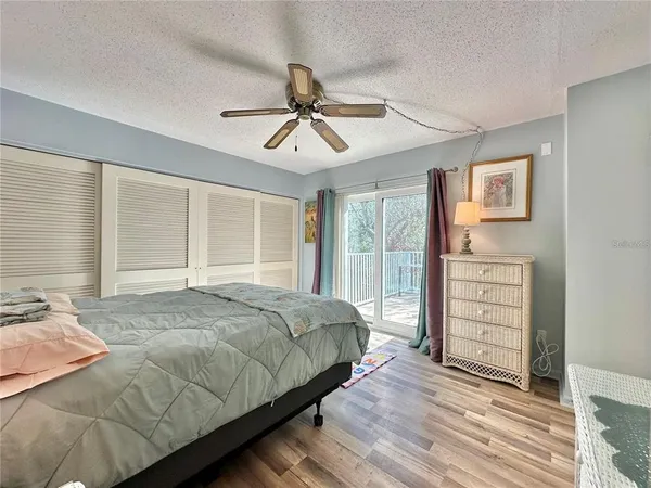 a bathroom with a double vanity sink toilet mirror and bathtub