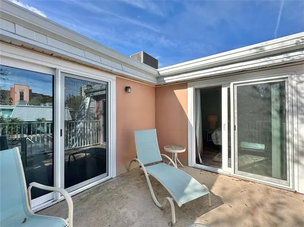a view of swimming pool with a yard and a large tree