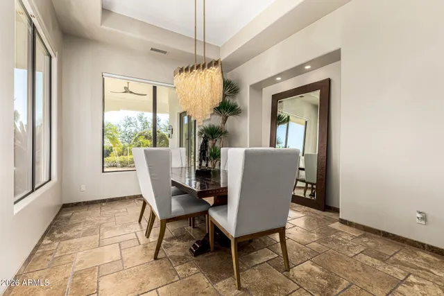 a view of a workspace with furniture and wooden floor