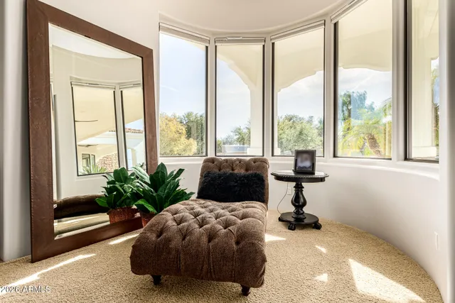 a view of a dining room with furniture and a window