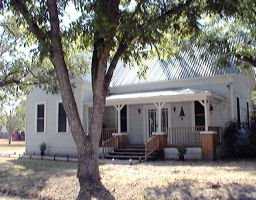 412 East 7th Street Elgin, TX 78621 - Photo 1 of 1 a front view of a house with a yard