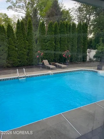 a front view of a house with a garden and plants
