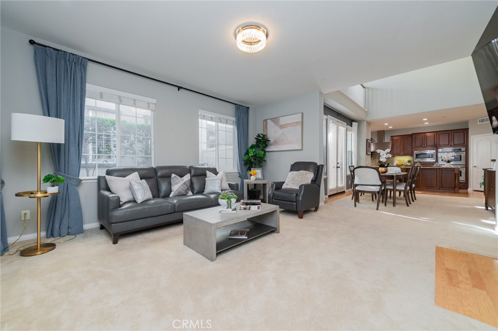 54 Shadowplay Irvine, CA 92620 - Photo 2 of 35 a living room with furniture and a table