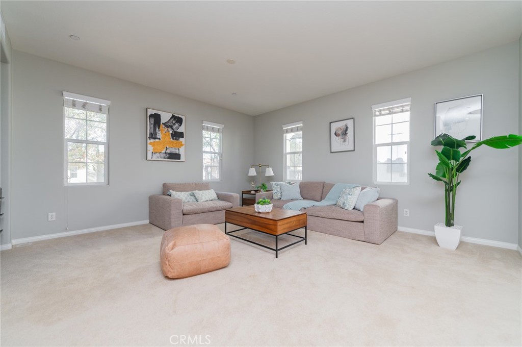54 Shadowplay Irvine, CA 92620 - Photo 22 of 35 a living room with furniture and a potted plant