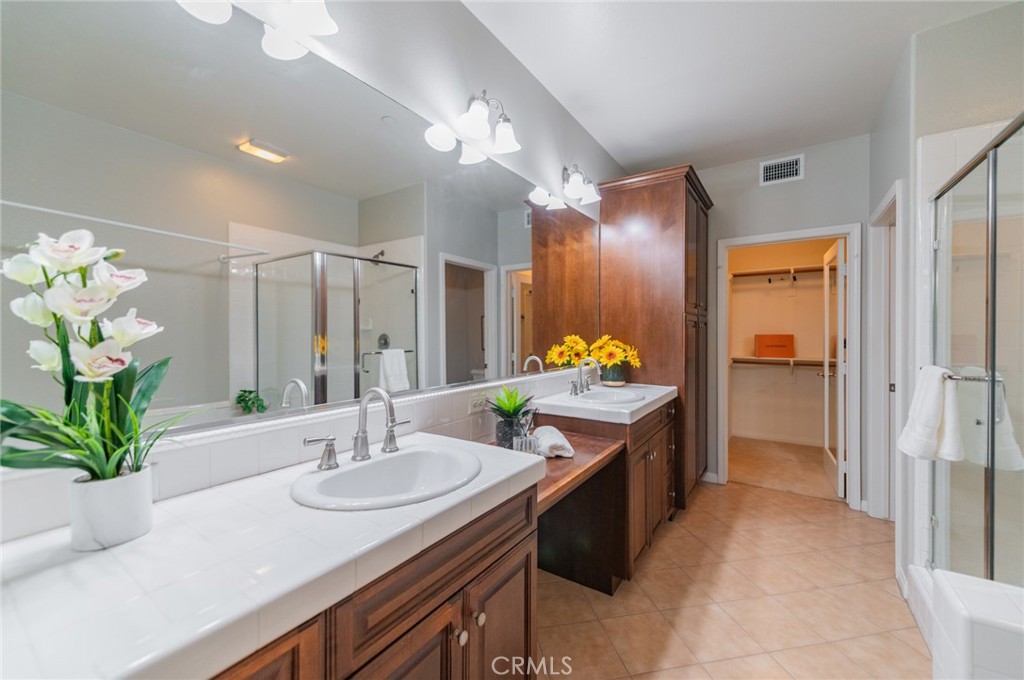 54 Shadowplay Irvine, CA 92620 - Photo 7 of 35 a bathroom with a sink and a mirror