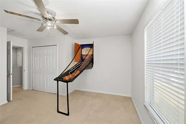 a room with lots of windows and white walls