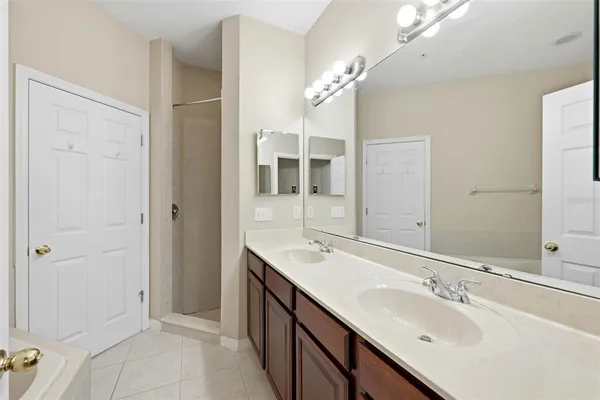 a bathroom with a sink double vanity and a mirror