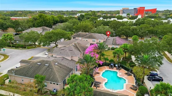 an aerial view of a house with a yard